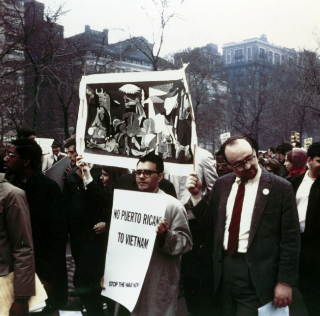 Alicia Legg, Vietnam protest rally in Central Park with a banner bearing the image of <em>Guernica</em>, New York, 1967