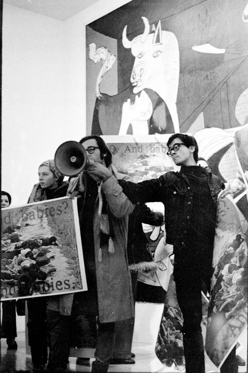 Jan van Raay, The Art Workers' Coalition and Guerrilla Art Action Group protest in front of <em>Guernica</em>, MoMA, New York, January 8, 1970